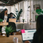 Diverse colleagues working in office together